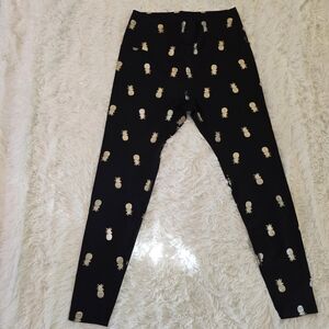 Beyond Yoga Black Leggings with Gold Pineapple Pattern